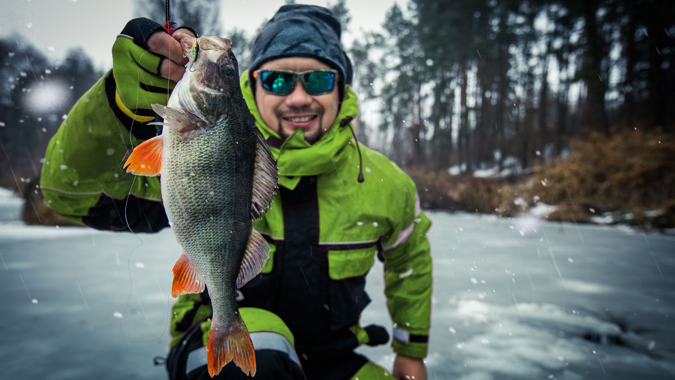 Ice Fishing Success with Man Holding a Fish